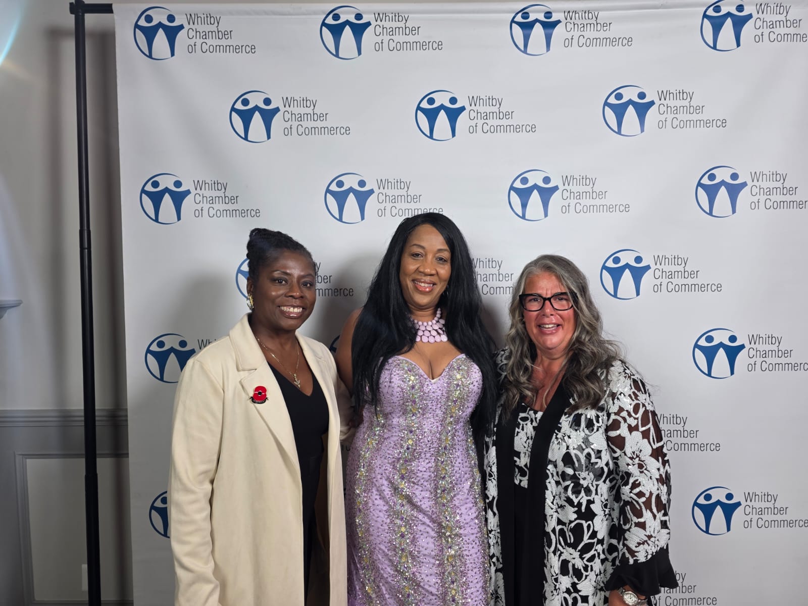 Stacey Lepine-Fisher with community members at a Whitby Chamber of Commerce event.
